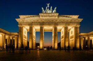 Berlin day tour-Berlin gate-brandenburger-Tor shining yellow in a dusk . 2 Days berlin city tour